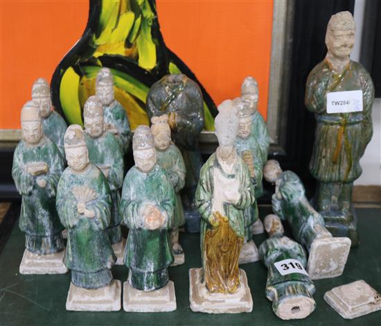 Fourteen Chinese green glazed pottery figures of attendants, Ming dynasty or later